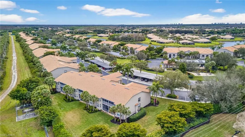 Aerial view of property's location featuring nearby suburban area
