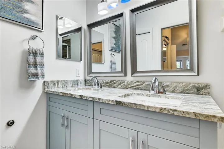 Full bathroom featuring double vanity