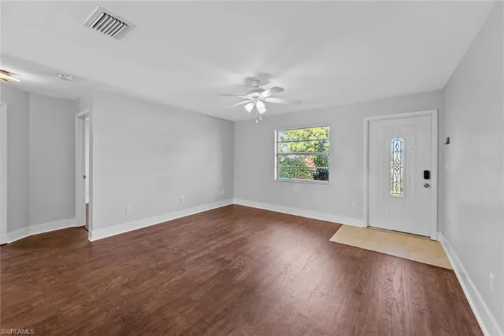 Foyer featuring ceiling fan and dark hardwood / wood-style flooring