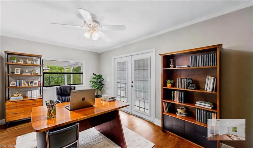 Home office with light hardwood / wood-style flooring, ornamental molding, french doors, and ceiling fan