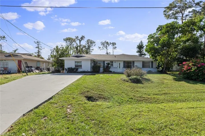 Ranch-style house with a front lawn