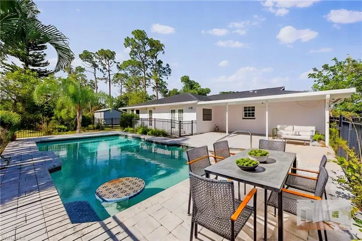 View of swimming pool with an outdoor living space and a patio