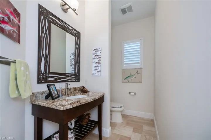 Half bath off den and used as pool bath