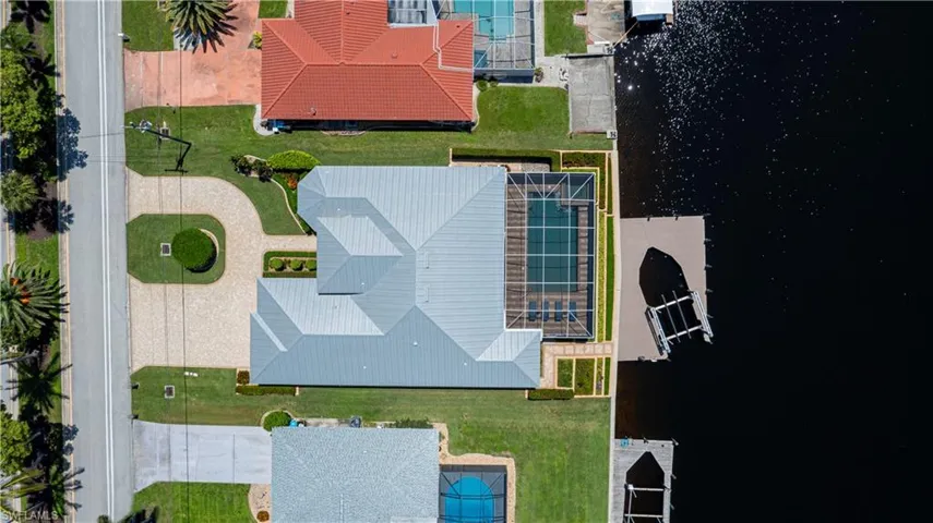 Located on 200' wide direct access canal with wrap around dock