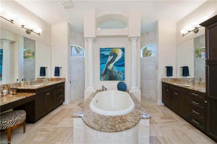 Two vanities, soaker tub and huge walk through shower in master bath