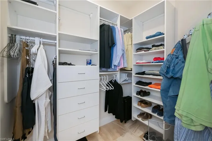 Two walk in Master Closets with custom shelving