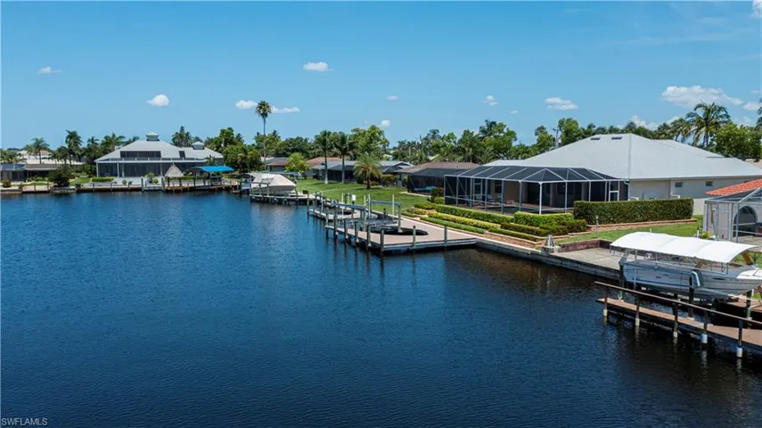 Located on rare 200' wide canal