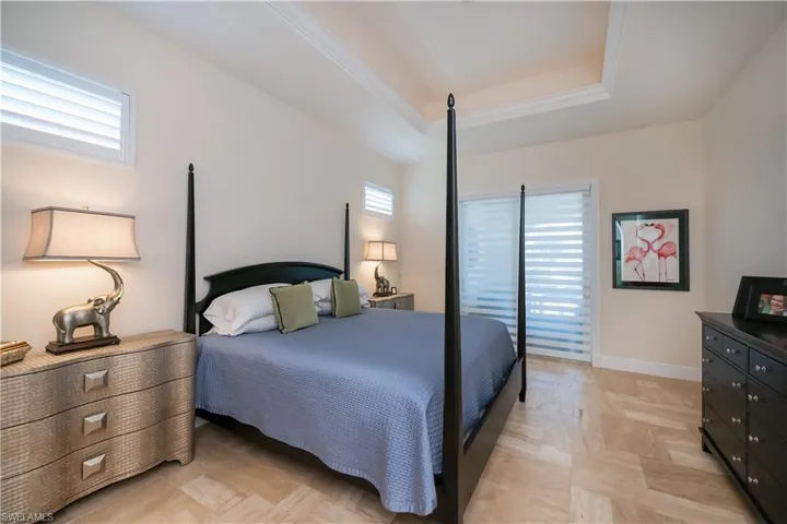 Spacious Master Bedroom with architectural ceiling details and recessed lighting