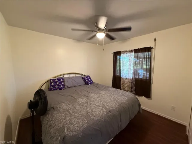 Bedroom featuring wood finished floors and ceiling fan