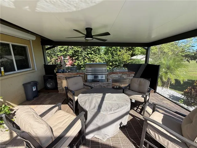View of patio featuring a ceiling fan and area for grilling