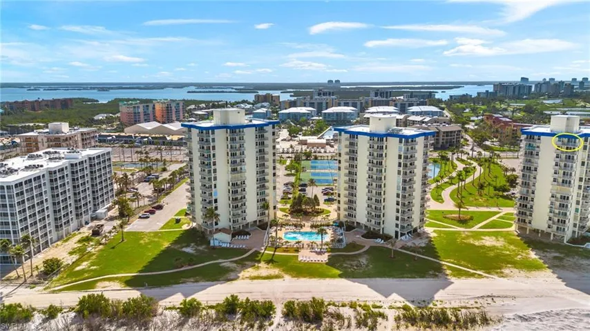 View of urban area featuring a large body of water and a pool area