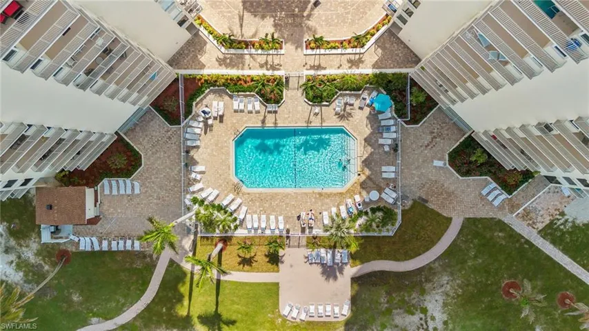 Community pool with a patio