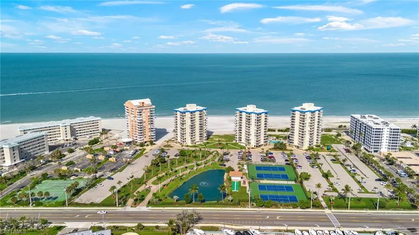 Bird's eye view of a large body of water and apartment complex