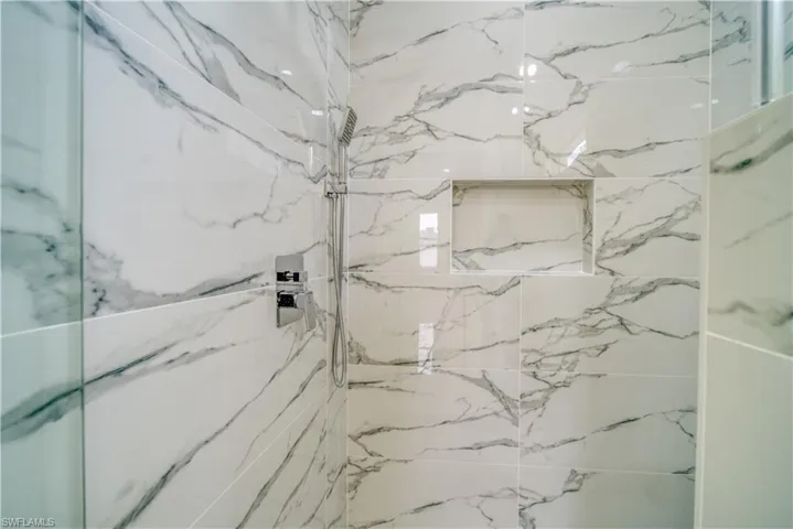 Bathroom featuring a tile shower