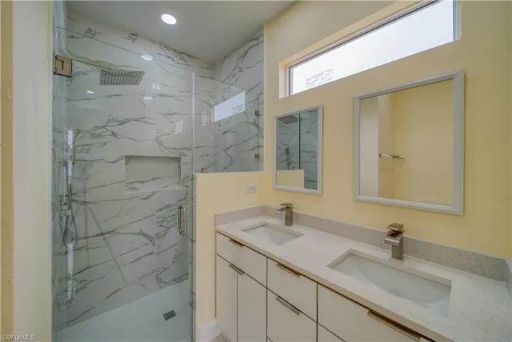 Bathroom featuring vanity and walk in shower