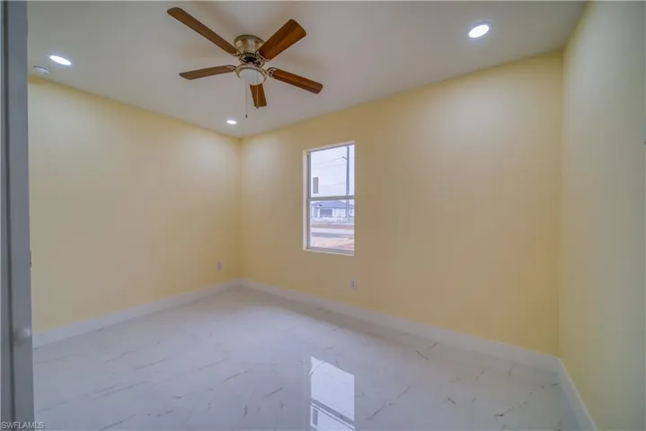 Spare room featuring ceiling fan