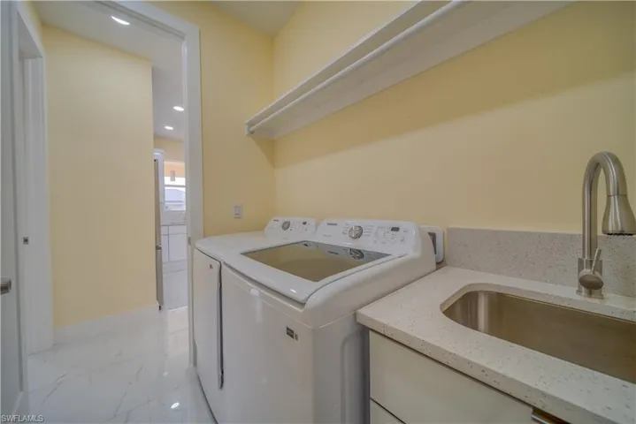 Laundry room featuring sink