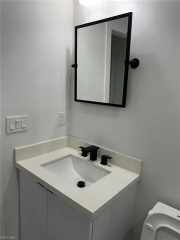 Bathroom with toilet and vanity