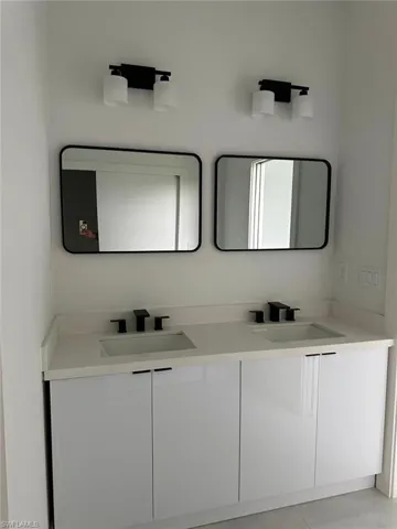 Bathroom featuring double vanity
