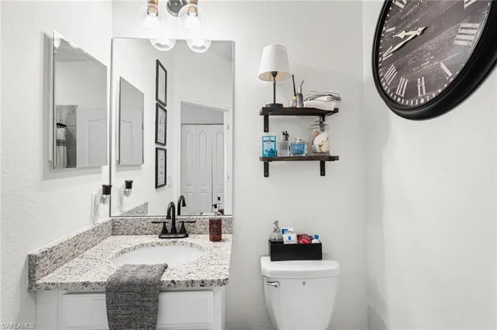 Half bath with vanity and toilet