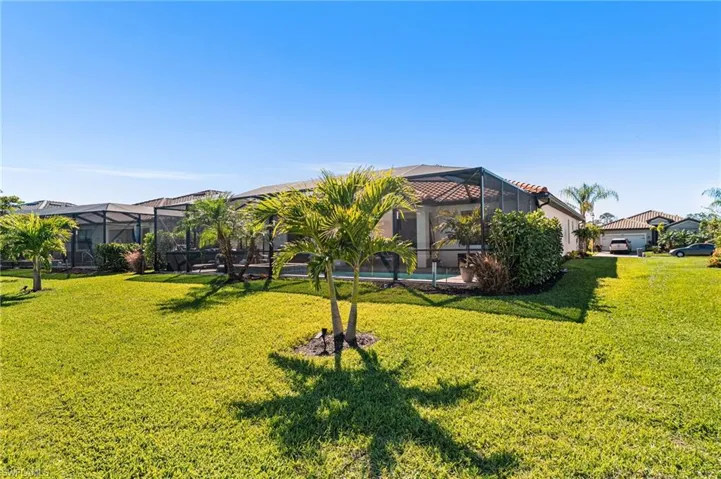 View of yard with a lanai