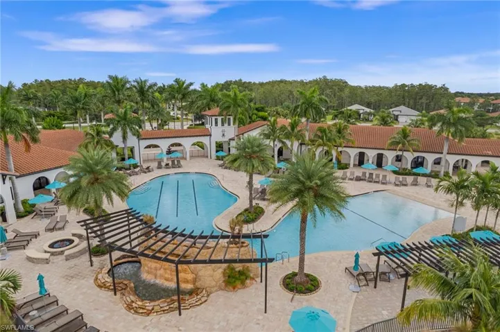 Pool featuring a fire pit and a patio