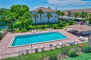 Lakeside pool with brick paver sun deck