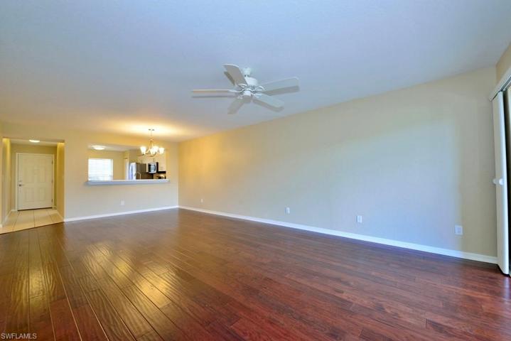 Gorgeous hand-scraped hardwood floors grace the very generous living area
