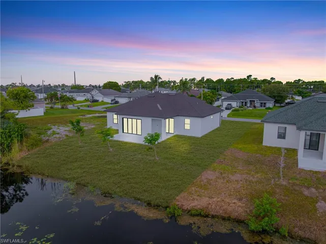 Aerial view at dusk of a residential view and a water view