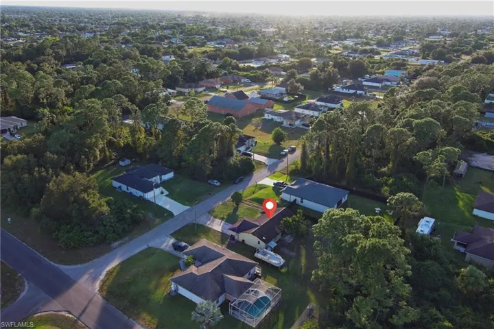 Aerial view of property's location featuring nearby suburban area