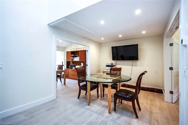 Meeting space featuring attic access, recessed lighting, and light wood finished floors