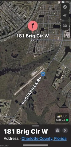 Aerial view of lot, the neighborhood chain of lakes, and nature trail that leads from behind the property South through nature preserves and a waterway crossing.