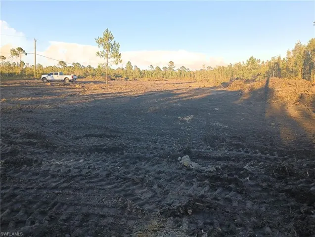 View of yard with a rural view