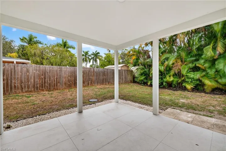 Fenced backyard with a patio