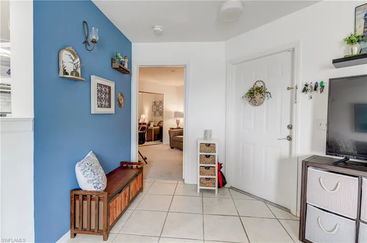 Foyer featuring light tile patterned flooring