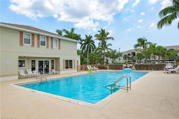 Community pool with a patio