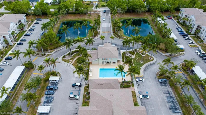View of property location with a large body of water and a pool area