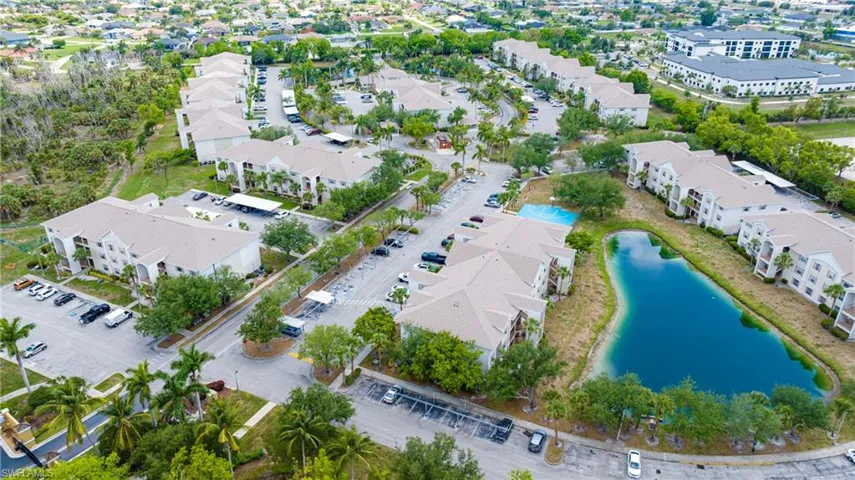 Aerial perspective of suburban area with a nearby body of water