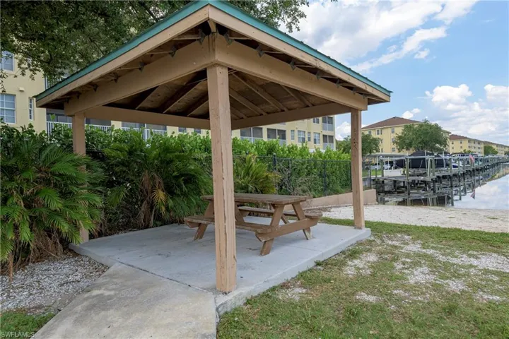View of patio / terrace featuring a gazebo & grills