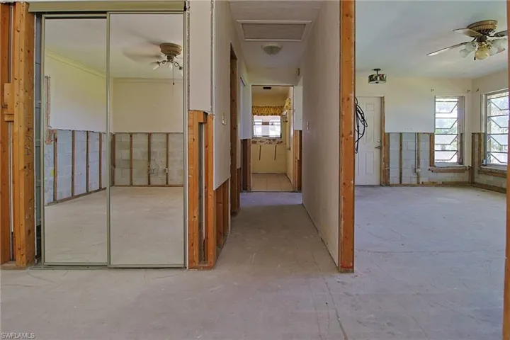 Open interior framing showcasing bare studs and concrete flooring