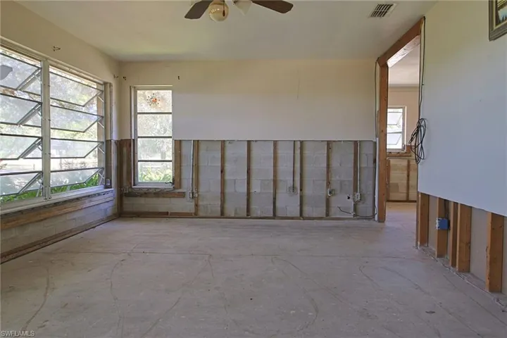 Interior space featuring exposed stud framing and concrete block