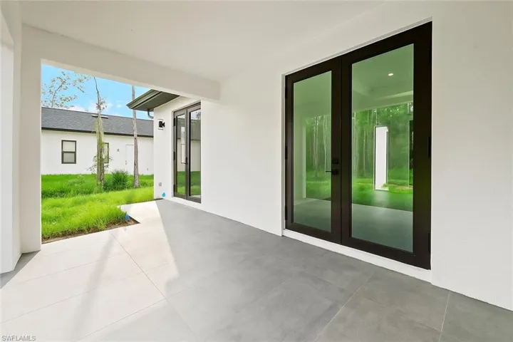 View of patio featuring french doors