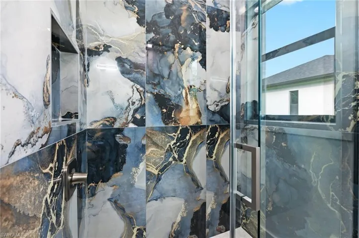 Bathroom view of a marble finish shower