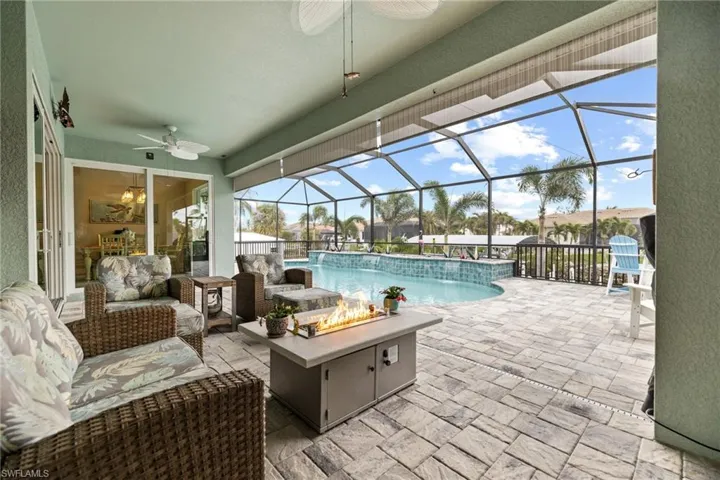 Covered under Truss Patio Sitting area overlooking Pool & Canal