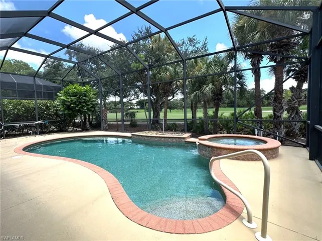 Screened pool overlooks golf course.