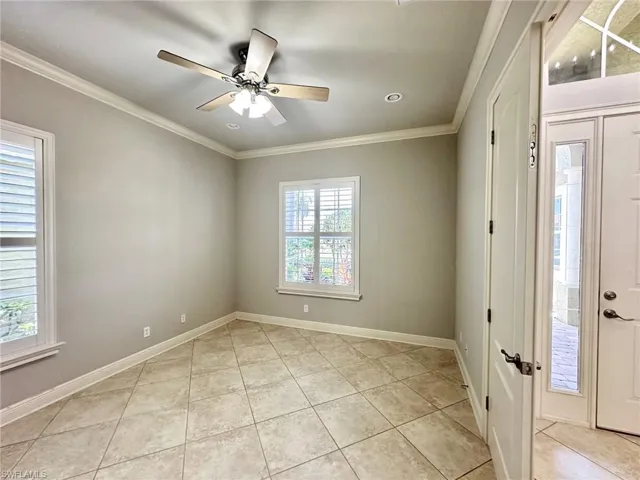 Den with double doors and lots of light.