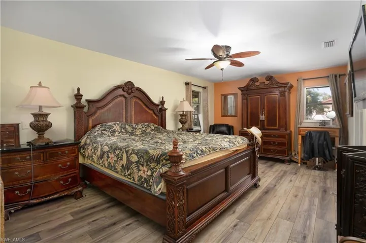 Bedroom featuring hardwood / wood-style flooring and ceiling fan