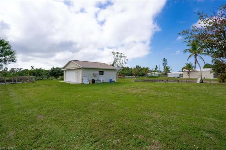 View of yard featuring a garage