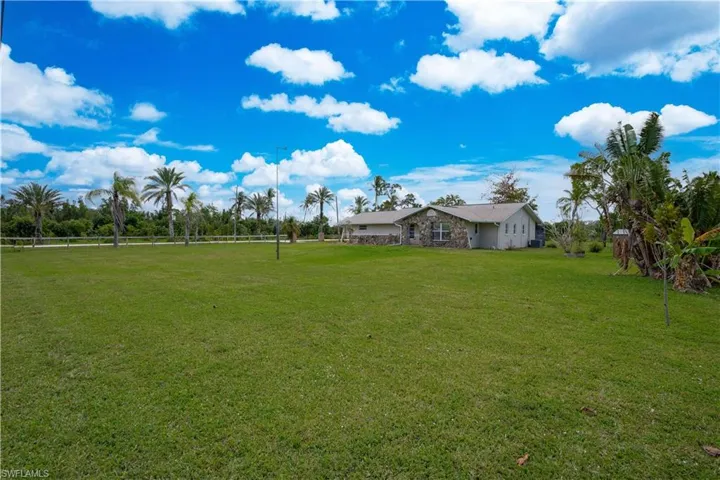 View of yard with a rural view