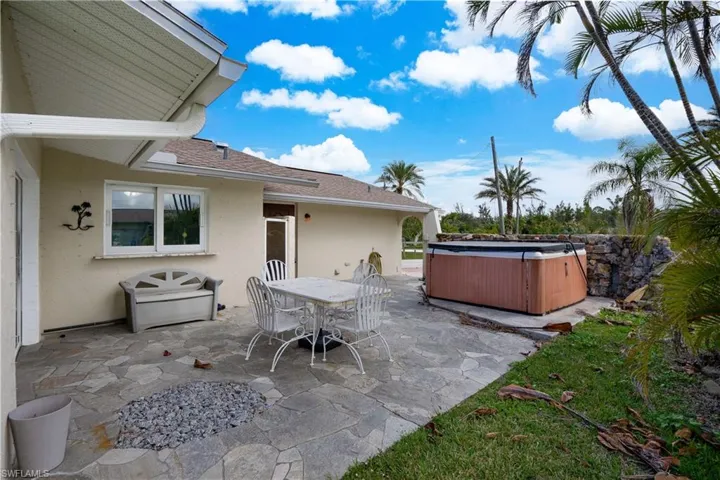 View of patio / terrace featuring a hot tub